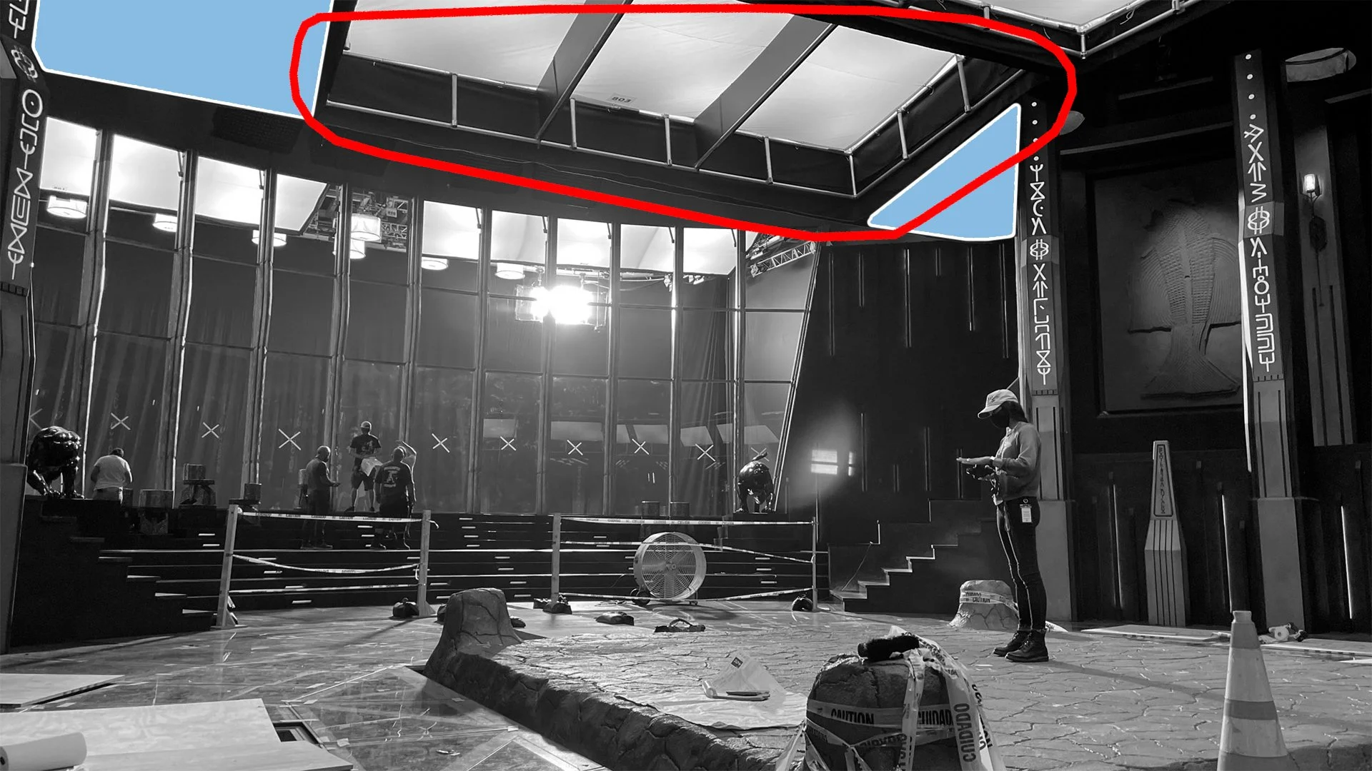 Professional film production sound stage with cinematic lighting rigs and camera equipment