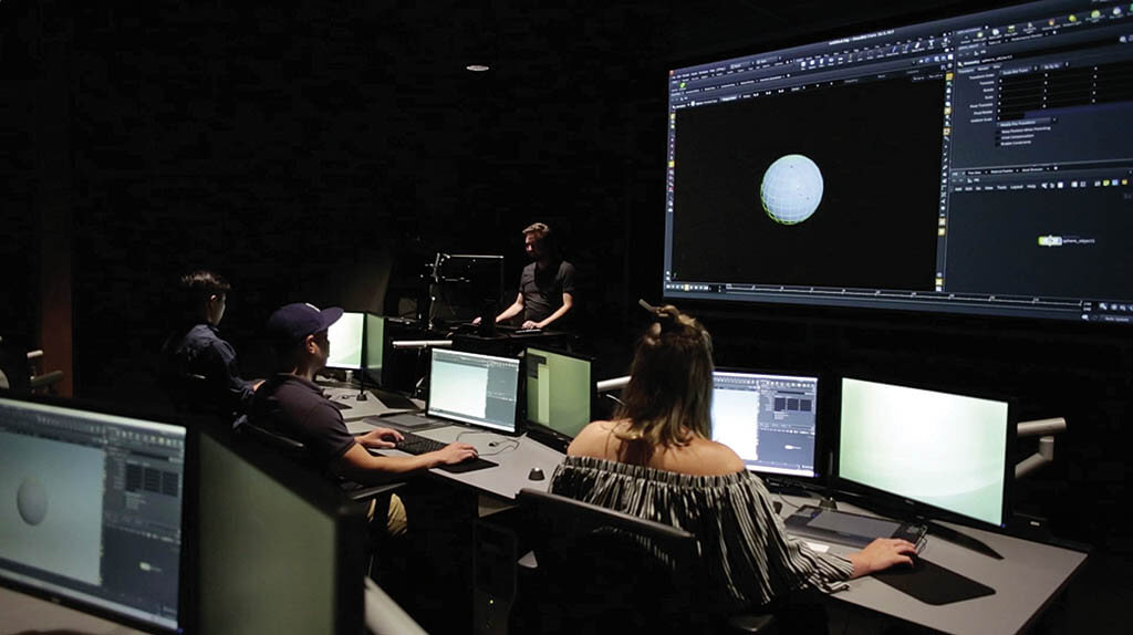 VFX studio workstation with multiple monitors showing digital effects in a dark professional environment